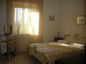 Кровать или кровати в номере Ai Prati Vecchi