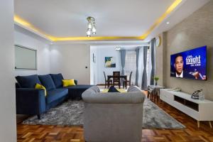 Μια τηλεόραση ή/και κέντρο ψυχαγωγίας στο Tranquil Residence by Seluveto Homes