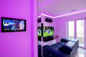 TV a/nebo společenská místnost v ubytování Suite Tropea