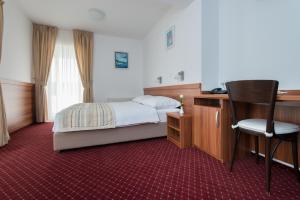 Postel nebo postele na pokoji v ubytování Hotel Villa Nova