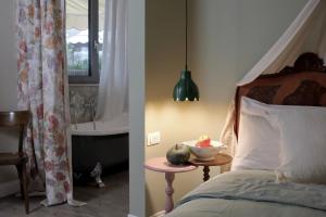 a bedroom with a bed and a bowl of fruit on a table at Casa Fellin 1891 B&B in Cles