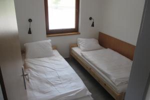 Postel nebo postele na pokoji v ubytování Hotel&Wellness Knížecí rybník