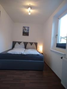 Posteľ alebo postele v izbe v ubytovaní Ferienwohnung Anton