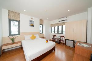Cama ou camas em um quarto em Happy Day Riverside Hotel & Spa Danang by Haviland