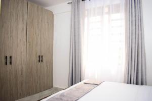 Voodi või voodid majutusasutuse Mzinyi Homes toas