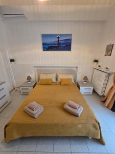 A bed or beds in a room at Antonella home b&b