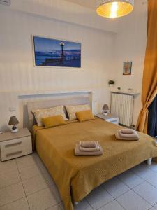 A bed or beds in a room at Antonella home b&b