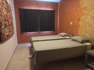 Postel nebo postele na pokoji v ubytování Vila Babosa