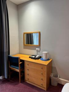 Postel nebo postele na pokoji v ubytování Citi Hotel Aberdeen