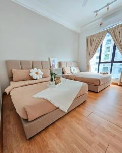Ένα ή περισσότερα κρεβάτια σε δωμάτιο στο The Platino 3BR Next To Paradigm Mall +27 φωτογραφίες
