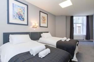 Postel nebo postele na pokoji v ubytování Citi Hotel Aberdeen