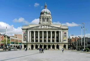 a large building with a clock tower on top of it at Studio Flat in Nottingham