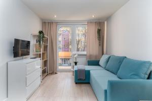 TV a/nebo společenská místnost v ubytování Nad Sudołem Stylish Apartment