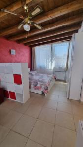 a bedroom with a bed and a ceiling fan at La Dea Busa in Canosa di Puglia +12 photos