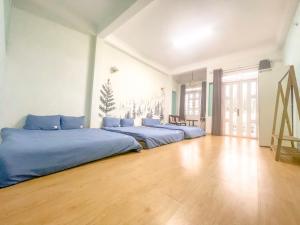 Postel nebo postele na pokoji v ubytování Xenia Đà Lạt 2