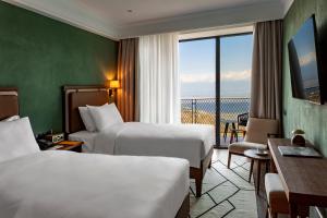 Letto o letti in una camera di BODBE Hotel