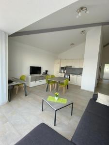 a living room with a couch and a table at Appartement 17 in Oerlinghausen +16 photos