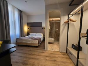 Postel nebo postele na pokoji v ubytování Hotel Porta Pia + 36 fotografií