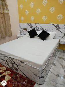 Postel nebo postele na pokoji v ubytování Yash Paying Guest House