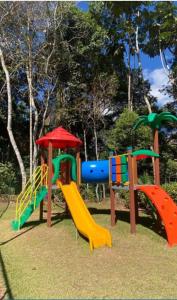 a playground with a slide and a slideintend at Vista Azul in Pedra Azul