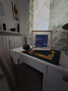 A television and/or entertainment centre at Antonella home b&b