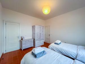 Postel nebo postele na pokoji v ubytování Lightbooking Villa Charco Azul Frontera