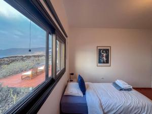 Postel nebo postele na pokoji v ubytování Lightbooking Villa Charco Azul Frontera