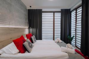 Posteľ alebo postele v izbe v ubytovaní GórSKI Przystanek Apartament Satoła 2