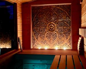 a wooden wall with a door in a room at Buddhas Bed & Wellness - Retreat - FEEL GOOD FOOD - B&B- mit viel Herz für Körper Geist & Seele in Tosterglope