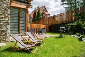 Vonkajšia záhrada v ubytovaní GórSKI Przystanek Apartament Satoła 2