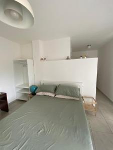 Ένα ή περισσότερα κρεβάτια σε δωμάτιο στο FF Houses - Piazzolla di Nola