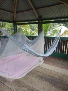 a hammock in a gazebo at La montagne verte in Palimé +13 photos