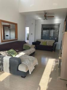 a living room with two couches and a couch at Villa Del Sol in Alicante