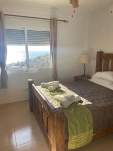 a bedroom with a bed and a large window at Villa Del Sol in Alicante +49 photos