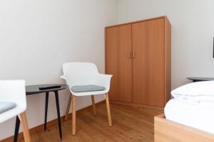 Postel nebo postele na pokoji v ubytování Pension Longhin Maloja - Self Check In
