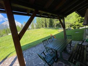 a picnic table and chairs on a patio at Chalet Josi in Leutasch