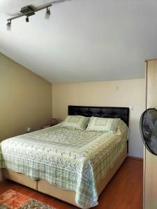 a bedroom with a large bed in a room at The Rooftop Urla in Urla