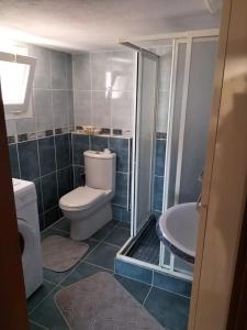 a bathroom with a toilet and a sink at The Rooftop Urla in Urla