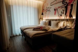 Postel nebo postele na pokoji v ubytování Hotel AX