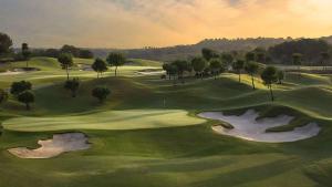 an overhead view of a golf course with two golf greens at Cosy Casa Valentino in Orihuela Costa