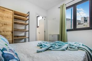 Ένα ή περισσότερα κρεβάτια σε δωμάτιο στο Telde City Loft With Solarium