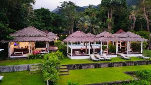 an image of a resort with chairs and umbrellas at Paradise Cottage in Ko Chang