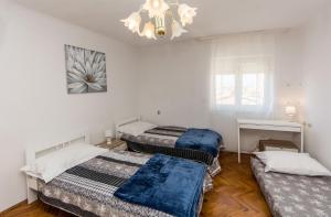 Postel nebo postele na pokoji v ubytování Apartment Dragica