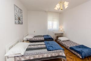 Postel nebo postele na pokoji v ubytování Apartment Dragica