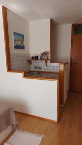 a kitchen with a counter top in a room at Apartment Brane in Bol +85 photos