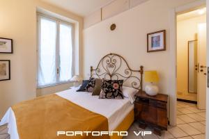 En eller flere senge i et værelse på Nini by PortofinoVip