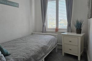 Ένα ή περισσότερα κρεβάτια σε δωμάτιο στο Contractors, families, great location, near transport links