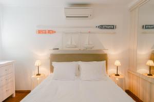 Postel nebo postele na pokoji v ubytování Pavi apartments Vila Amalia