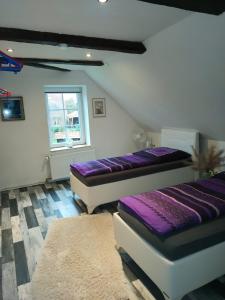 Katil atau katil-katil dalam bilik di Schönes Messe-Ferien Apartment mit vielen Extras