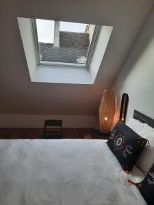 Ένα ή περισσότερα κρεβάτια σε δωμάτιο στο Maison Rinette